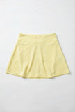 Yellow skirt on a light gray background