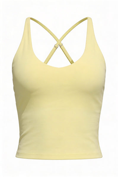 Yellow tank top with criss-cross straps on a white background